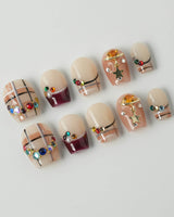 Cozy Plaid press-on nails in extra short coffin shape — British Plaid, Colorful Rhinestone & Planet Charm.