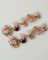 Cozy Plaid press-on nails in extra short oval shape — British Plaid, Colorful Rhinestone & Planet Charm.