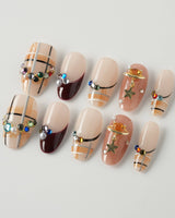 Cozy Plaid press-on nails in medium oval shape — British Plaid, Colorful Rhinestone & Planet Charm.
