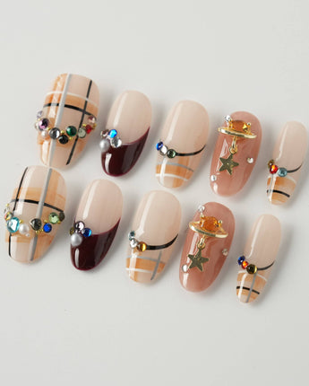 Cozy Plaid press-on nails in medium oval shape — British Plaid, Colorful Rhinestone & Planet Charm.