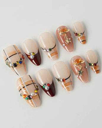 Cozy Plaid press-on nails in short almond shape — British Plaid, Colorful Rhinestone & Planet Charm.