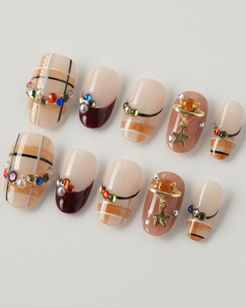 Cozy Plaid press-on nails in short oval shape — British Plaid, Colorful Rhinestone & Planet Charm.