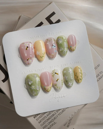 Cream Garden press-on nails in extra short almond shape — Pastoral Style, Hand-painted Bees & Wildflowers.