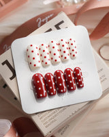 Creamy Cherry medium square press-on nails with red and white polka dots with creamy cherry styling