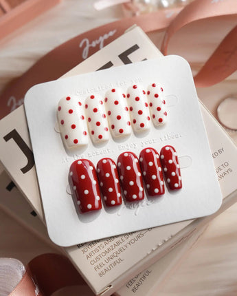 Creamy Cherry medium square press-on nails with red and white polka dots with creamy cherry styling