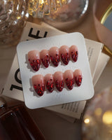 Crimson Queen nails in short almond — Nude Pink to Black-Red