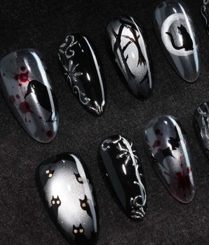 Crow Moon press on nails with a hand-painted crow on a branch, bare winter trees, black cats and bats on silver cat eye with 3D silver vines - image 1