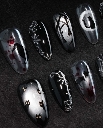 Crow Moon press on nails with a hand-painted crow on a branch, bare winter trees, black cats and bats on silver cat eye with 3D silver vines - image 1