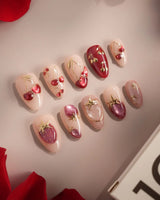 Crystal Berry press-on nails with nude base, berry red shimmer and glossy cherry accents