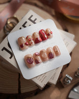 Crystal Berry short square press-on nails with red cat-eye cherry art and glossy gold details