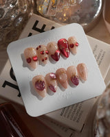 Crystal Berry short stiletto press-on nails with red cat-eye cherries and gold outline details