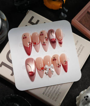 Crystal Cherry handmade press-on nails in medium stiletto shape by Joyee Nails