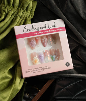 Wonderland Whims handmade floral nails with pink blossoms, pearls, and glossy gel finish