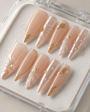 Venus close-up of pearl shell nail art with glossy gel finish
