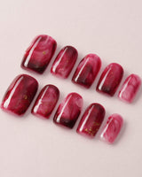 Gone with the Wind press-on nails with marbled burgundy and gold foil accents