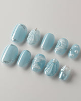 Mermaid Nail Designs Tale press-ons photographed to show the sculpted blue shell finish