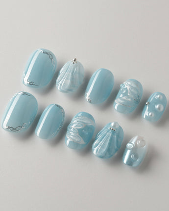 Mermaid Nail Designs Tale press-ons photographed to show the sculpted blue shell finish