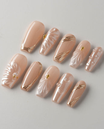 Venus pearly nude custom press-on nail set with shell and gold accents