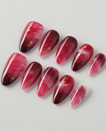 Gone with the Wind press-on nails with marbled burgundy and gold foil accents