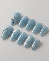 Close-up of Thump Bunny_Macaron showing light-shifting cat eye hearts and playful bunny art