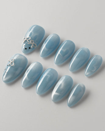 Close-up of Thump Bunny_Macaron showing light-shifting cat eye hearts and playful bunny art