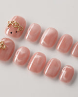 Thump Bunny reusable salon press-on nails with peach heart cat-eye design