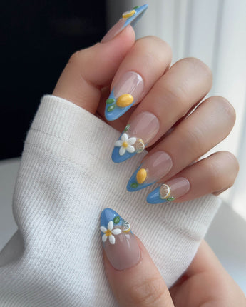 Lemon Grove nail art close-up showing Blue French, 3D Lemon & Florals. details