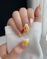 Caramel Bloom press-on nails in M medium almond with glossy caramel bloom nail art