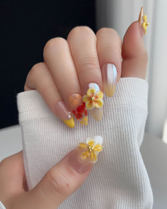 Caramel Bloom press-on nails in M medium almond with glossy caramel bloom nail art