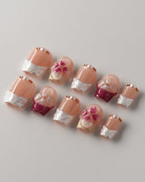 Duchess Purple custom-size floral nails with delicate purple blooms and glossy gel polish