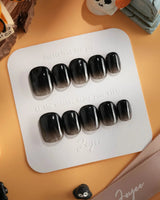Cutting Edge press-on nails in extra short squoval shape — Black ombre nails