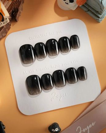 Cutting Edge press-on nails in extra short squoval shape — Black ombre nails