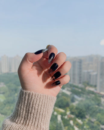 Cutting Edge nail art close-up showing Black ombre nails details