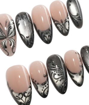 Damask press on nails with freehand black filigree scrollwork and a butterfly on nude and silver cat eye - image 1