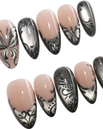 Damask press on nails with freehand black filigree scrollwork and a butterfly on nude and silver cat eye - image 1