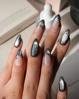 Damask press on nails with freehand black filigree scrollwork and a butterfly on nude and silver cat eye - image 2