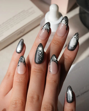 Damask press on nails with freehand black filigree scrollwork and a butterfly on nude and silver cat eye - image 2