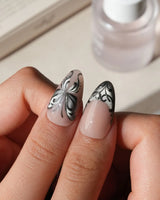 Damask press on nails with freehand black filigree scrollwork and a butterfly on nude and silver cat eye - image 4