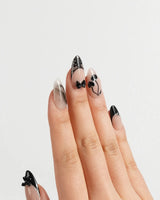 Dark Cherry press-on nails in medium almond shape — Chic Black & Nude, Lace Bows, Ink Marble Swirls & Glitter Heart Cherries.