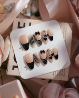 Dark Cherry handmade press-on nails featuring Chic Black & Nude, Lace Bows, Ink Marble Swirls & Glitter Heart Cherries.