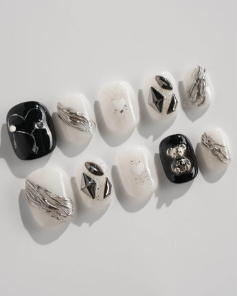 Dark Ice press-on nails in extra short squoval shape — black gradient silver chrome 3D gothic nails