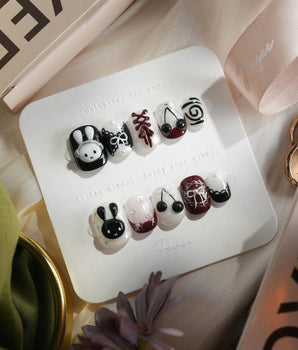 Dark Miffy nails in extra short squoval — black white red mix