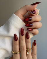 Deep Red Cat eye Nails nail art close-up showing red cat eye christmas holiday details