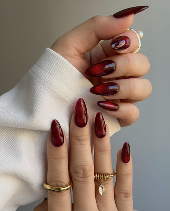 Deep Red Cat eye Nails nail art close-up showing red cat eye christmas holiday details