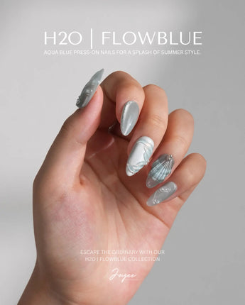 Dead Sea Blue medium almond custom size nails with glossy seafoam shell design