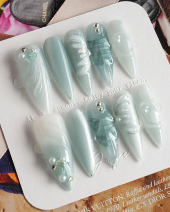 Dead Sea Blue reusable nails with carved shell texture and quiet luxury seafoam tones