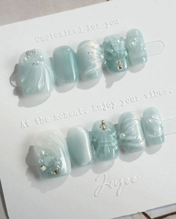 Dead Sea Blue in extra short square shape with pearl shell texture and green jelly gloss