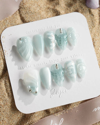 Dead Sea Blue in short stiletto shape with glossy ocean shell accents