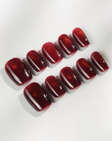 Deep Red Cat eye Nails press-on nails in extra short coffin shape — red cat eye christmas holiday