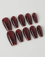 Deep Red Cat eye Nails press-on nails in medium coffin shape — red cat eye christmas holiday